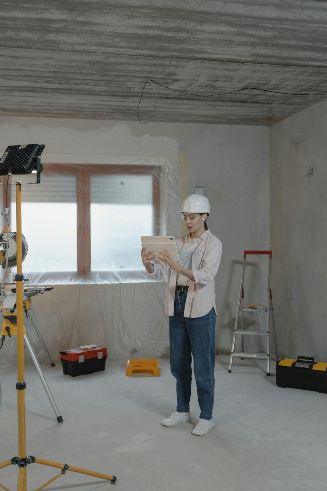 Investor reviewing a tablet on site